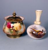 A Royal Worcester porcelain pot pourri jar and cover and a vase: the former of squat form with