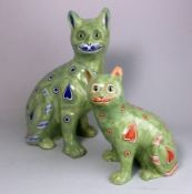 A Mosanic pottery cat and kitten: both in seated posture with curled tail with inset glass eyes,