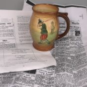 A Royal Doulton golfing mug: of bellied form relief decorated with golfers and caddies, 15 cm high.