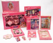 A Barbie teaset, a talking alarm clock and a collection of Barbie related toys and accessories:.