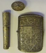 An Indian silver filigree cigarette case: together with a small oval box and a sleeve case,