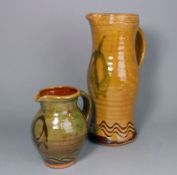 Clive Bowen (born 1943) two terracotta jugs: one of ribbed and bellied 'Medieval' form with incised
