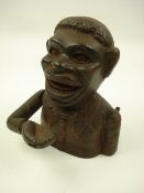 An American novelty cast iron money bank:, of typical form with rolling eyes and opening mouth,