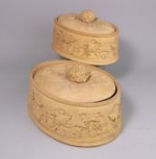 Two graduating Wedgwood cane ware pie dishes and covers: of oval form the dishes applied with a
