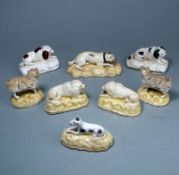 Eight Samuel Alcock porcelain dogs: comprising a mastiff, a pair of spaniels, two matching,