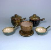 A group of studio pottery: comprising a pair of Sid Tustin stoneware one handled bowls and covers