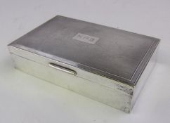 An Elizabeth II silver cigarette box, maker Garrard & Co Ltd,
