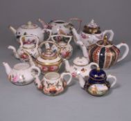 A group of teapots and kettles: comprising a Meissen flower encrusted teapot,