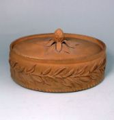 A cane ware pie dish and cover: of oval form the exterior of the dish moulded with an encircling