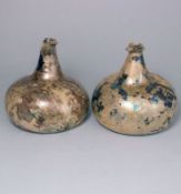 A pair of squat onion wine bottles: of dark olive colour with pronounced 'kick up',