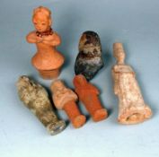 A group of six Chinese and other small pottery figures: including a standing figure of a woman,