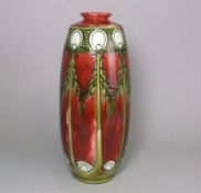 A Minton pottery Secessionist vase: of slender oviform tubelined with peacock feather motifs and
