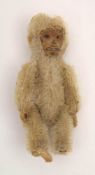 A Schuco white plush monkey brooch:, signed to pin as per title, 8.