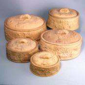 A graduating set of five Wedgwood cane ware game pie dishes: of oval form the exterior moulded in