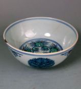 A Chinese Doucai medallion bowl: painted with fruiting trees and sprays of pomegranates,