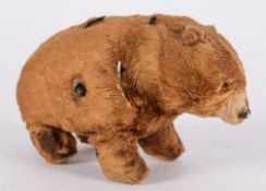 Schuco a brown plush covered clockwork bear with moving head:, 13cm.