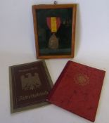 Two German WWII labour movement document books: and Belgium Commemorative War Medal.