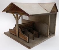 A late 19th/early 20th century wooden dolls stable 'Square Pinnell's Stable':,
