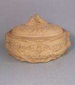 A large Wedgwood cane ware pie dish and cover: of oval form the dish embossed in high relief with