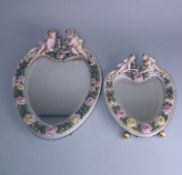 Two graduating German porcelain easel mirrors: each of flower encrusted heart shaped form