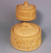 Two Wedgwood cane ware pie dishes and covers: of circular form the larger dish moulded with hung