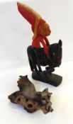 A collection of carved wooden objects to include Indian on horseback, Buddha, lizard, wooden horn,