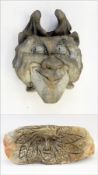 A green man carved out of stone and a reconstituted stone goblin (2)