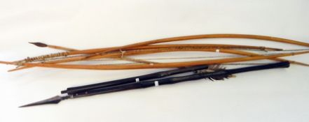 Four African tribal bows with one feathered arrow (4)
