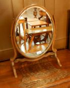 Georgian style mahogany oval bevelled frame dressing table mirror, on splayed supports,