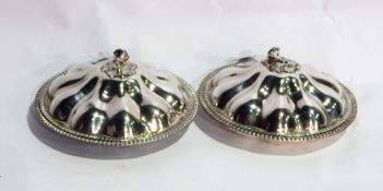 A pair of silver plated entree dishes and covers, with cast floral finials and reeded borders, dia.