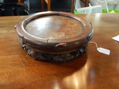 Chinese carved hardwood jardiniere stand with foliate carved frieze,