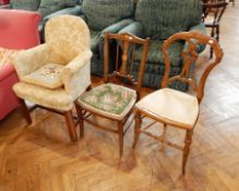A Victorian covered armchair in floral decoration and two others