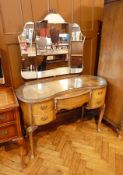 A Queen Anne style walnut veneer triple mirror back kidney shaped  dressing table with central