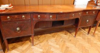 A Georgian style mahogany bowfront sideboard, the centre section with two frieze drawers,
