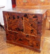 Oriental inlaid cabinet of various woods,