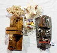 A pair of carved bookends showing stylised deer, a piece of coral, a conch shell,