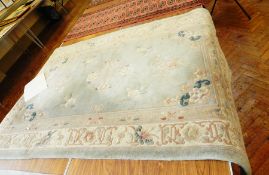 Chinese wool rug on pale blue ground, floral and scroll decoration,
