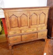18th century oak food cupboard, with shaped fielded panel doors enclosing shelf,