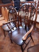 Eight wheelback chairs on turned and bobbin supports united by H-stretcher and two wheelback carver