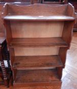 An oak open bookcase of four shelves, width 56cm,