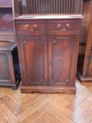 A mahogany veneer side cupboard,