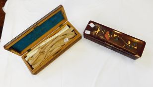 A leather glove box containing original glove stretchers, the base expanding for the gloves,