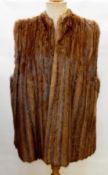 A vintage fur waistcoat made from a jacket (having had sleeves and collar removed),