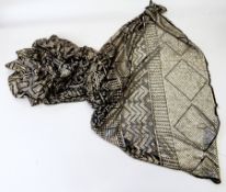A large 1920's black net and white-coloured metal shawl