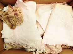 A quantity of table linen including napkins, mats, a large embroidered tablecloth, etc.