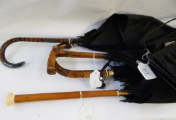 Silver-mounted malacca-handled umbrella, another with wooden ivory handle,