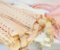 A quantity of vintage underwear including whalebone corsets, petticoats, etc.