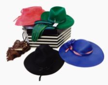 An emerald green Fedora-style felt hat, a black felt hat,