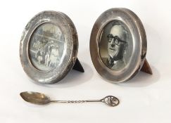 A pair of George V silver circular photograph frames with easel supports, London 1920,