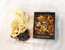 A quantity of costume jewellery including an amethyst bead necklace, a carved bone necklace,